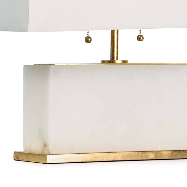Natural brass base of an alabaster table lamp